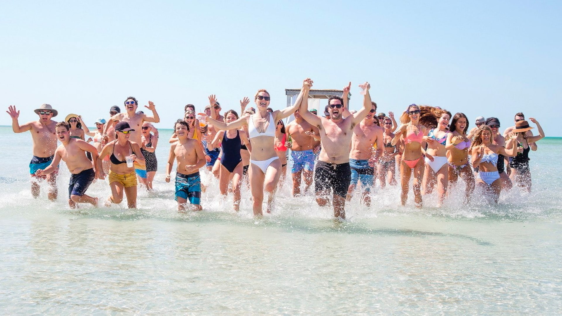 Guests enjoying the Beach Club at Mahogany Bay Resort & Beach Club