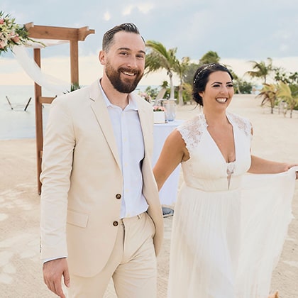 Happy Couple celebrating wedding at Mahogany Bay Resort & Beach Club