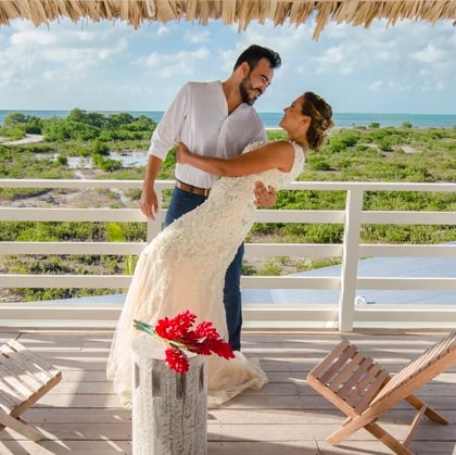 Happy couple celebrating at Mahogany Bay Resort & Beach Club