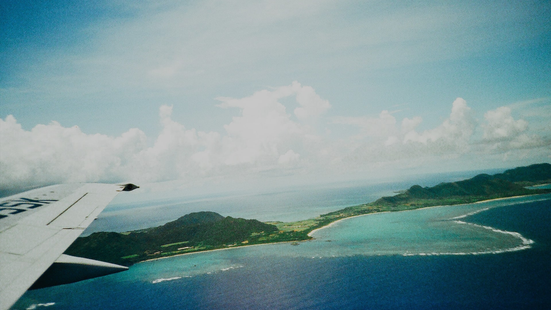 Flying in airplane over sea and land