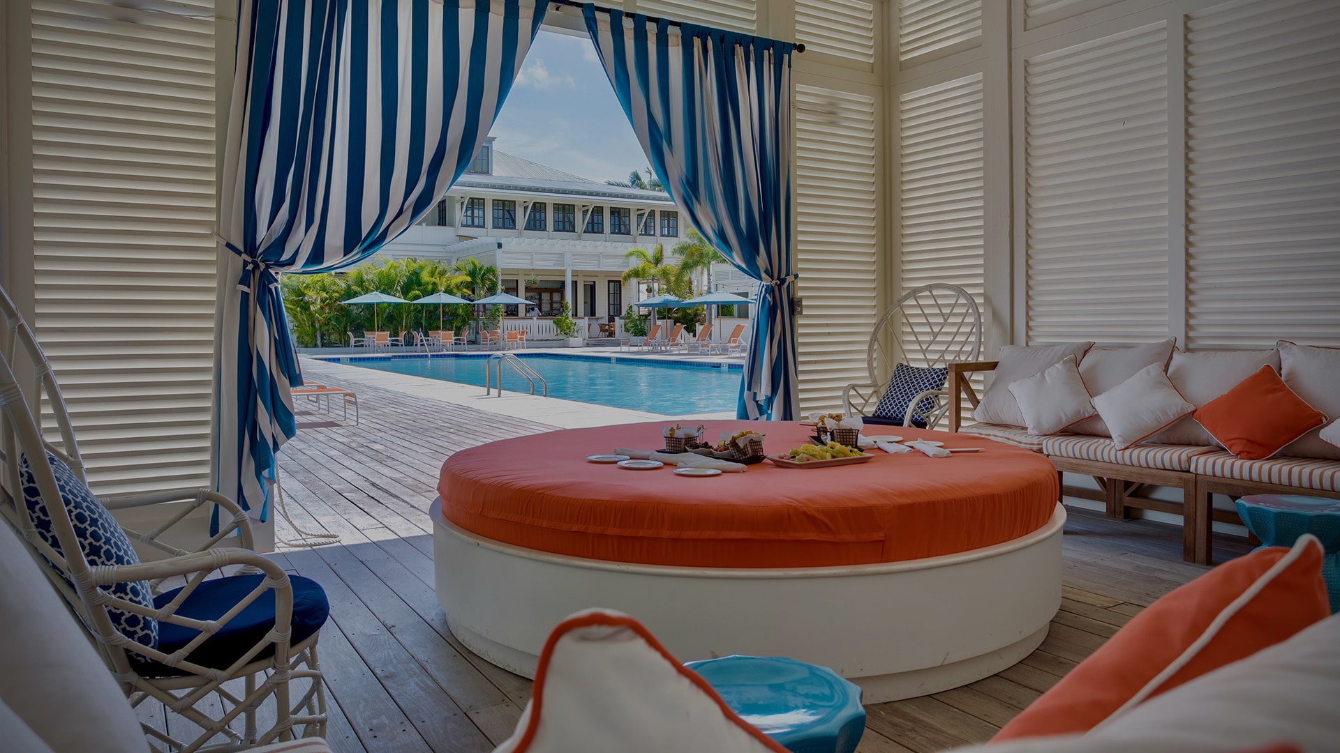 Poolside cabanas at Mahogany Bay Resort & Beach Club