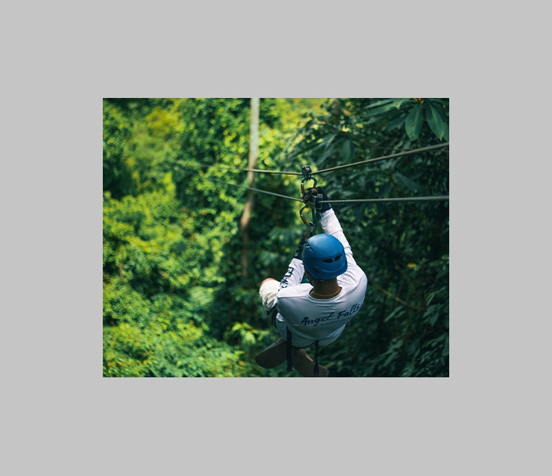 Man on zipline in the jungle