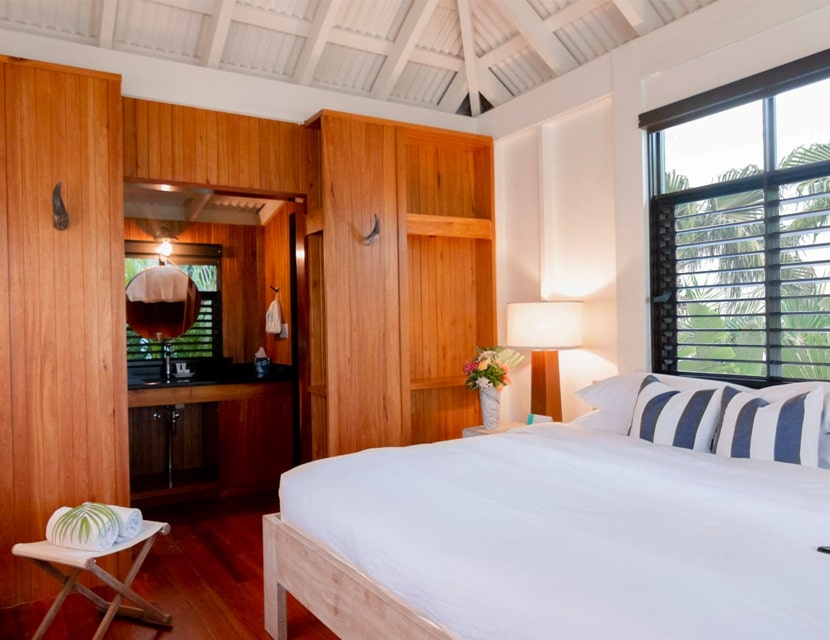 Interior shot of the Garden Cottage showing the bed and bathroom space