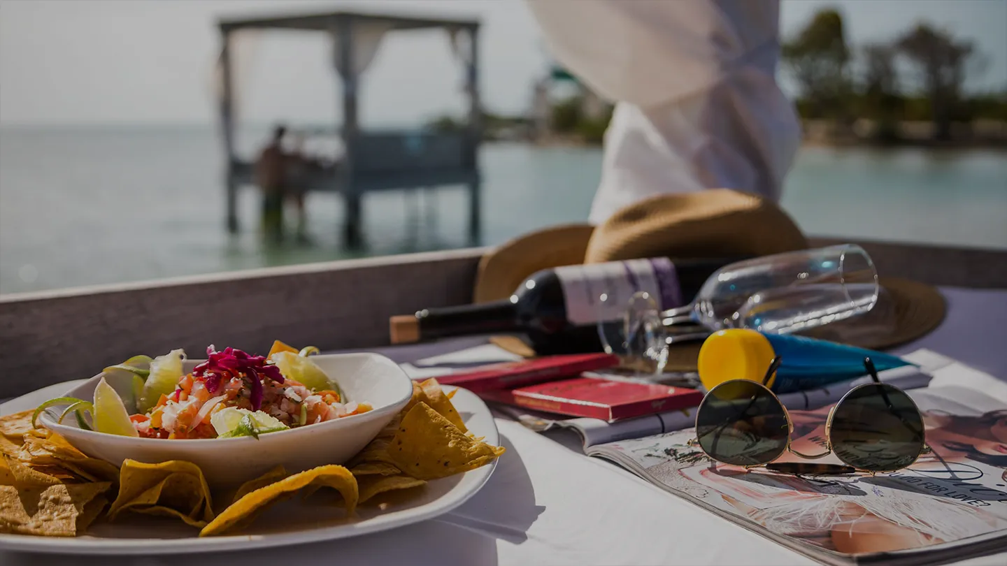 Food and drinks on an overwater bed at the Beach Club Mahogany Bay Resort San Pedro Ambergris Caye Belize