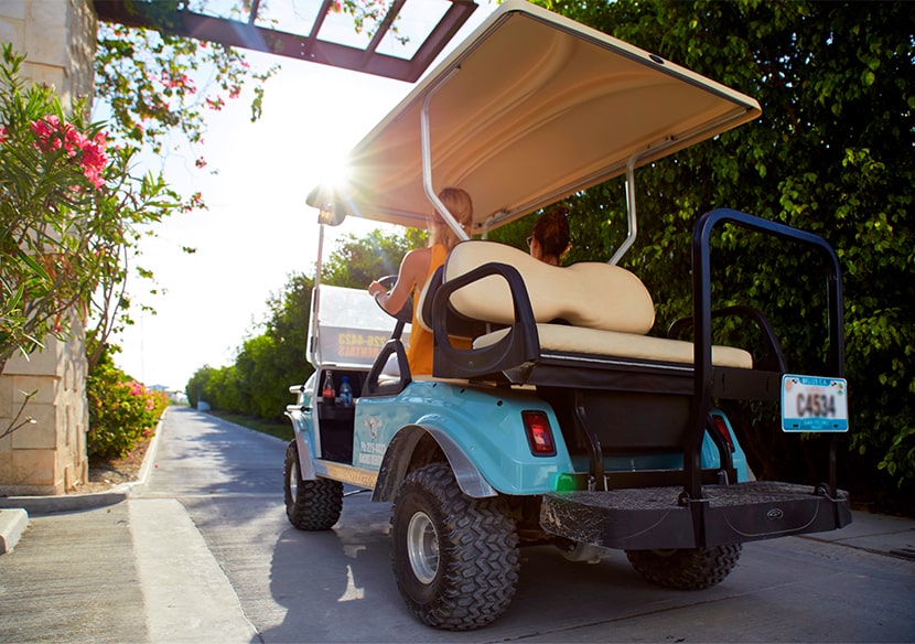 Golf cart driving around Mahogany Bay Resort & Beach Club