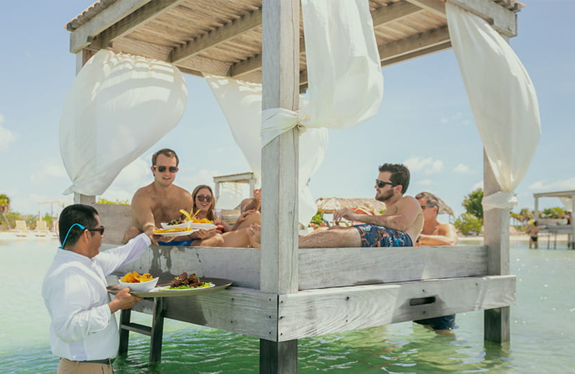 Birthday Fun in an Overwater Beach Bed at the Beach Club at Mahogany Bay Resort and Beach Club